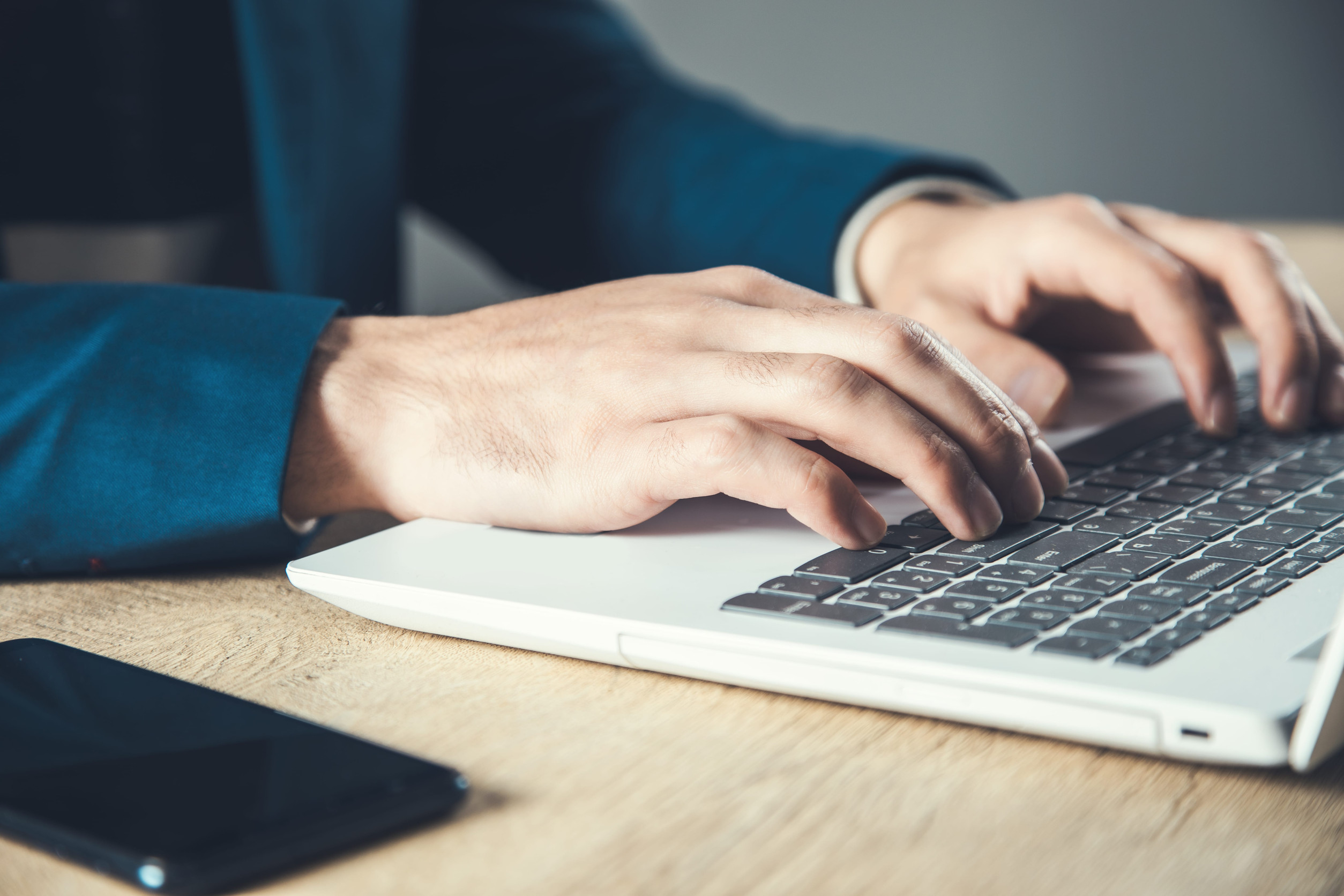 A Man Using A Laptop