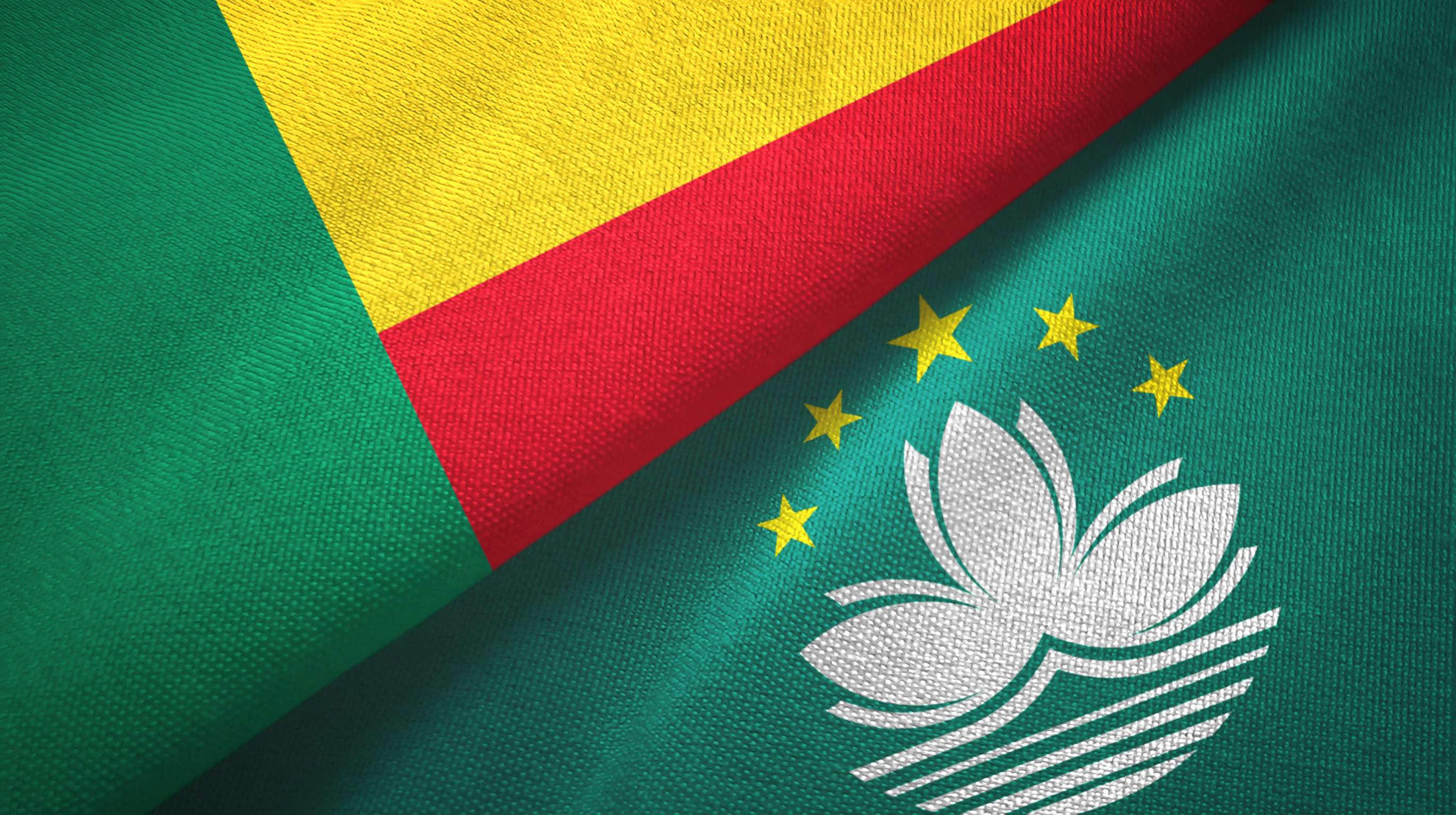 Benin And Macau Two Folded Flags Together