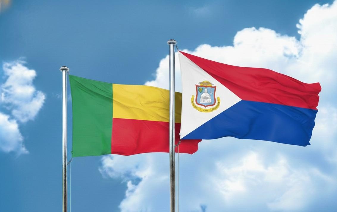 Benin And Saint Martin Flags Waving Together