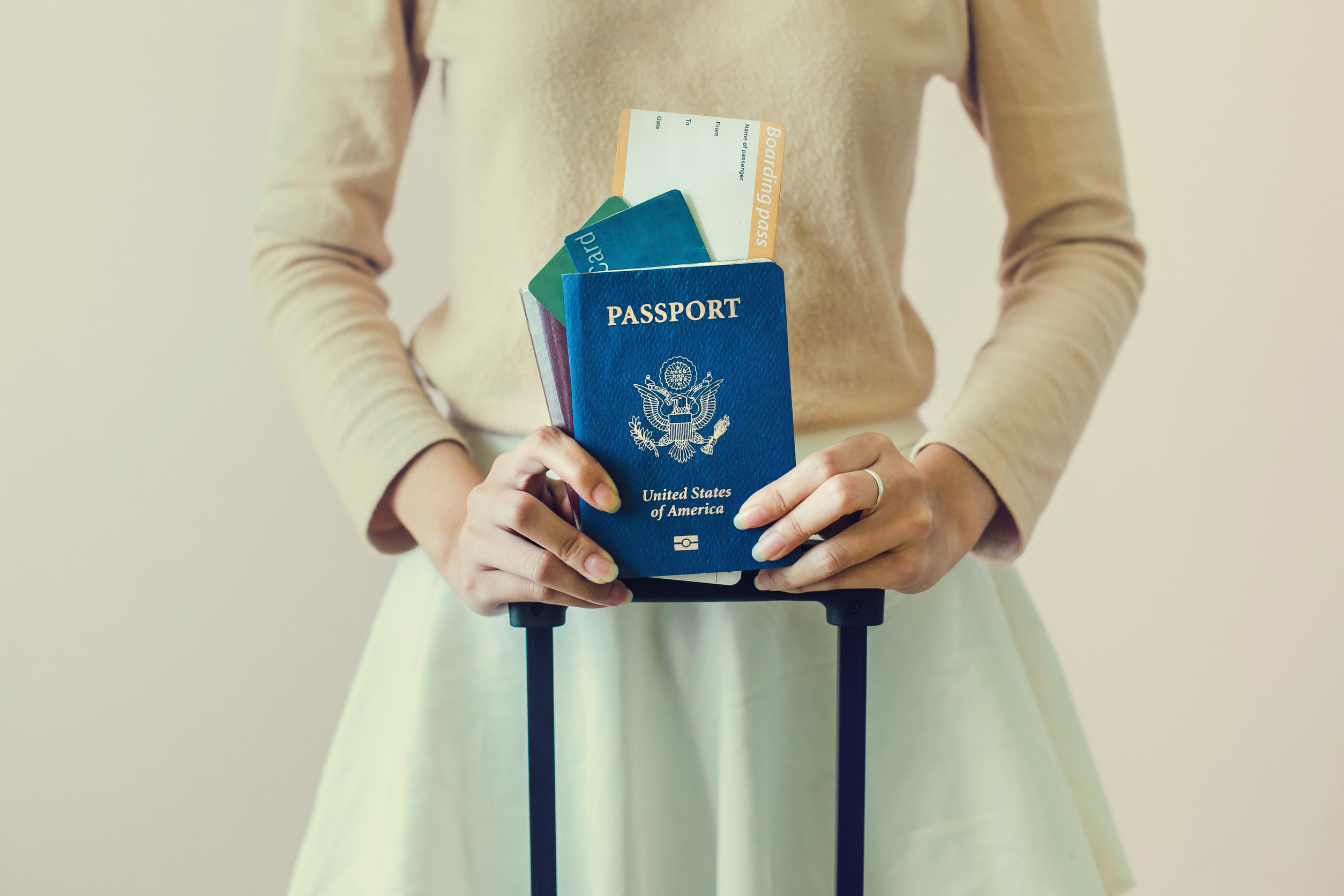 Closeup Of Girl Holding Passports And Boarding Pass