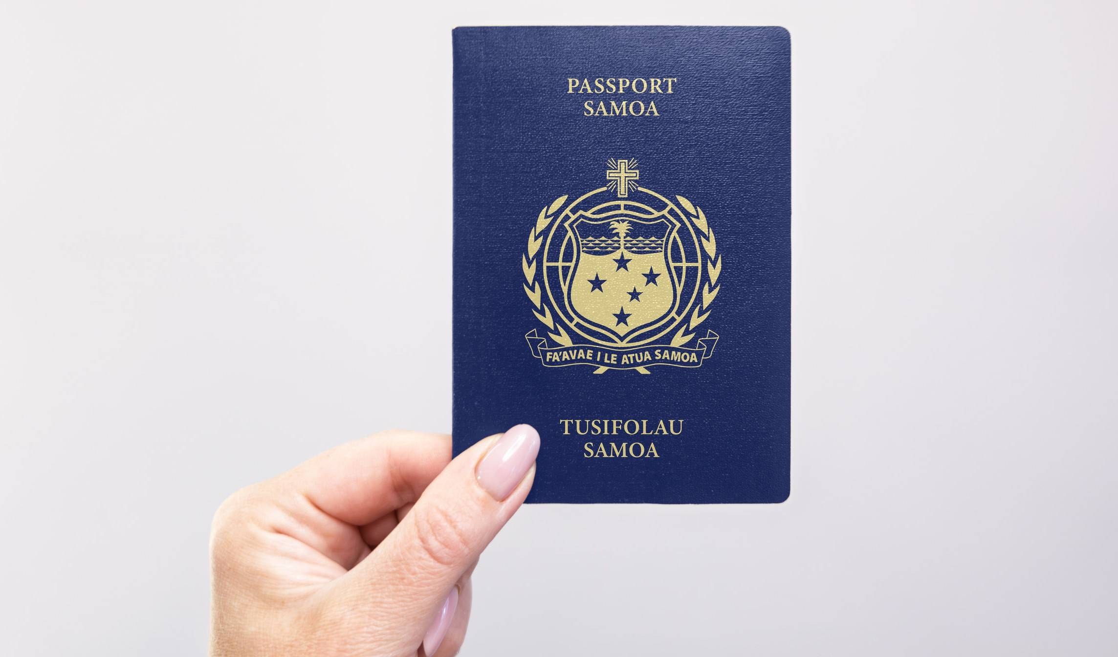 Hand holding a Samoa passport