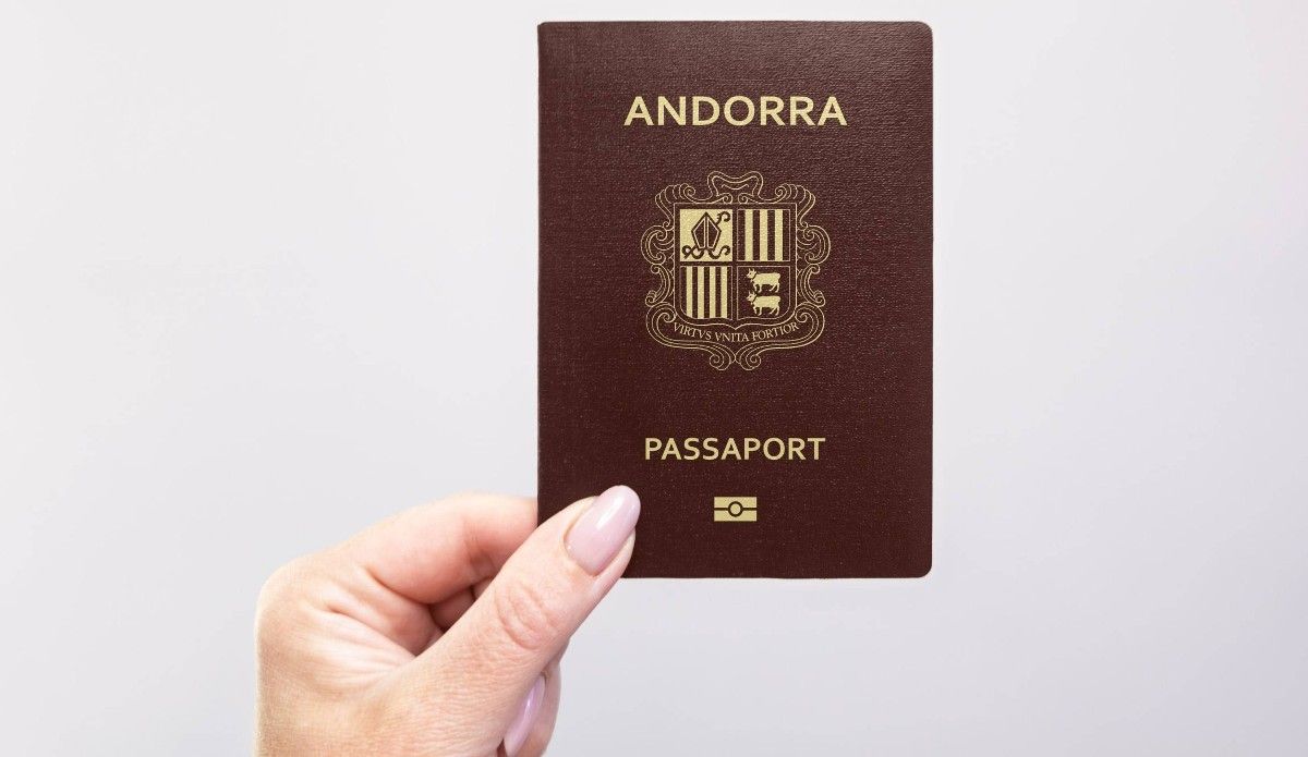 Hand holding an Andorra passport