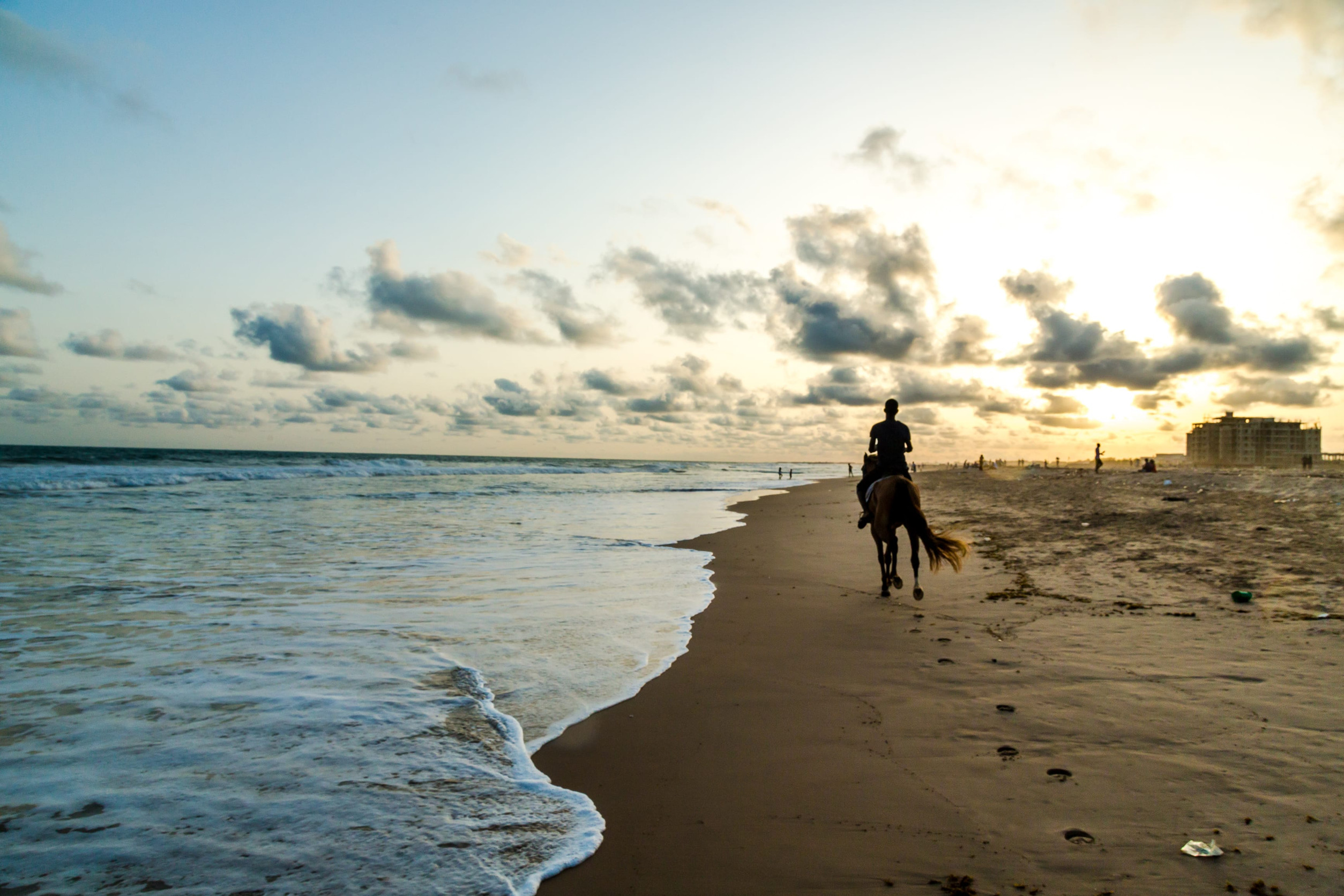 Man Riding A Horse At Obama Beach In Benin