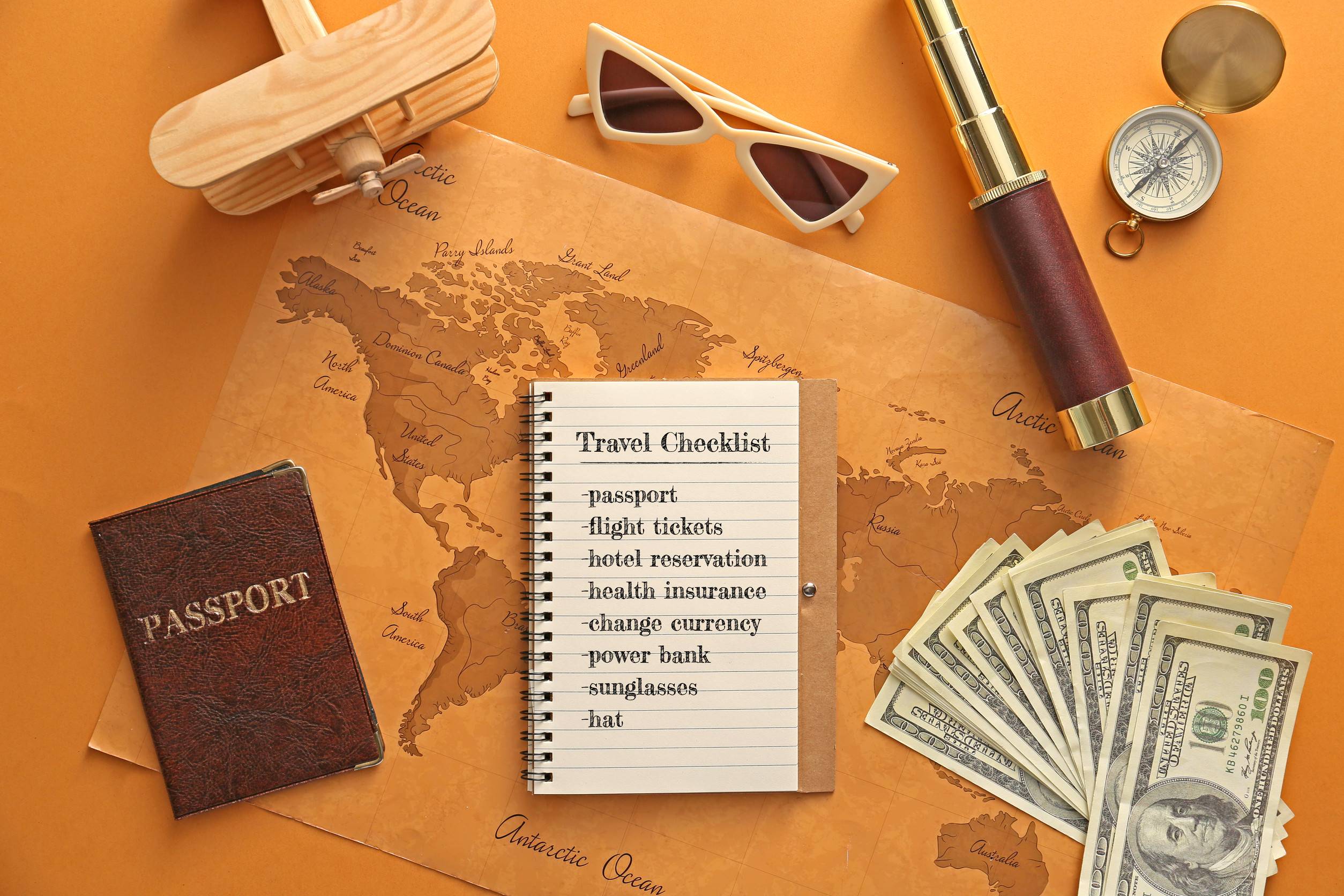 Notebook With Check List Of Things To Do Before Traveling And World Map On Color Backgroundm